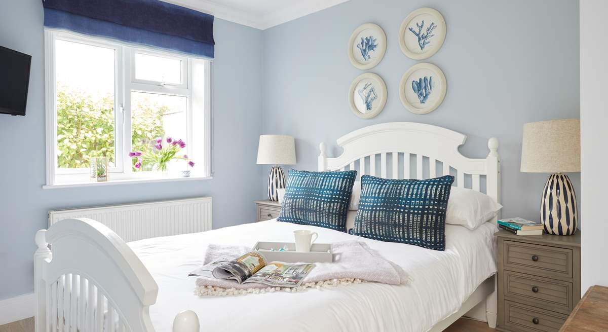 Bedroom one is beautifully presented in calm and soothing colours.