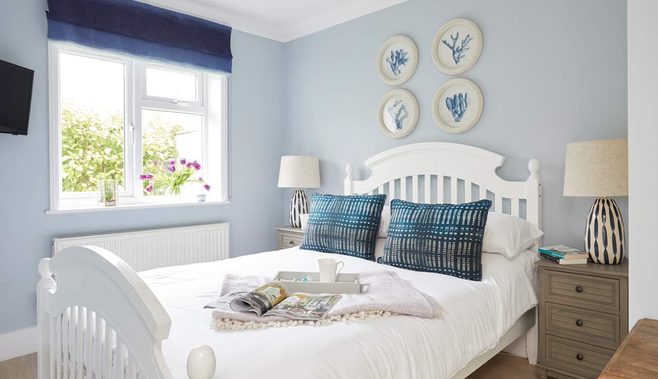 Bedroom 1 is beautifully presented in calm and soothing colours.