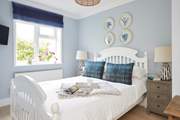 Bedroom one is beautifully presented in calm and soothing colours.
