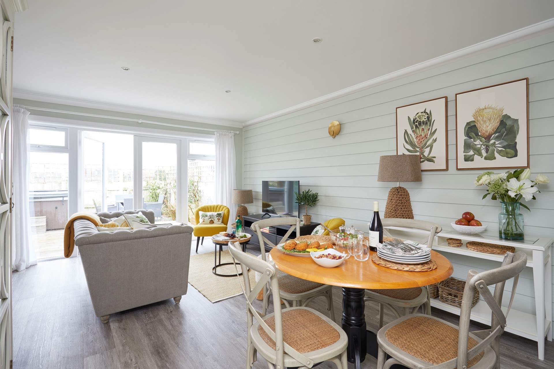 The lovely open plan living space, spot the hot tub out on the terrace.