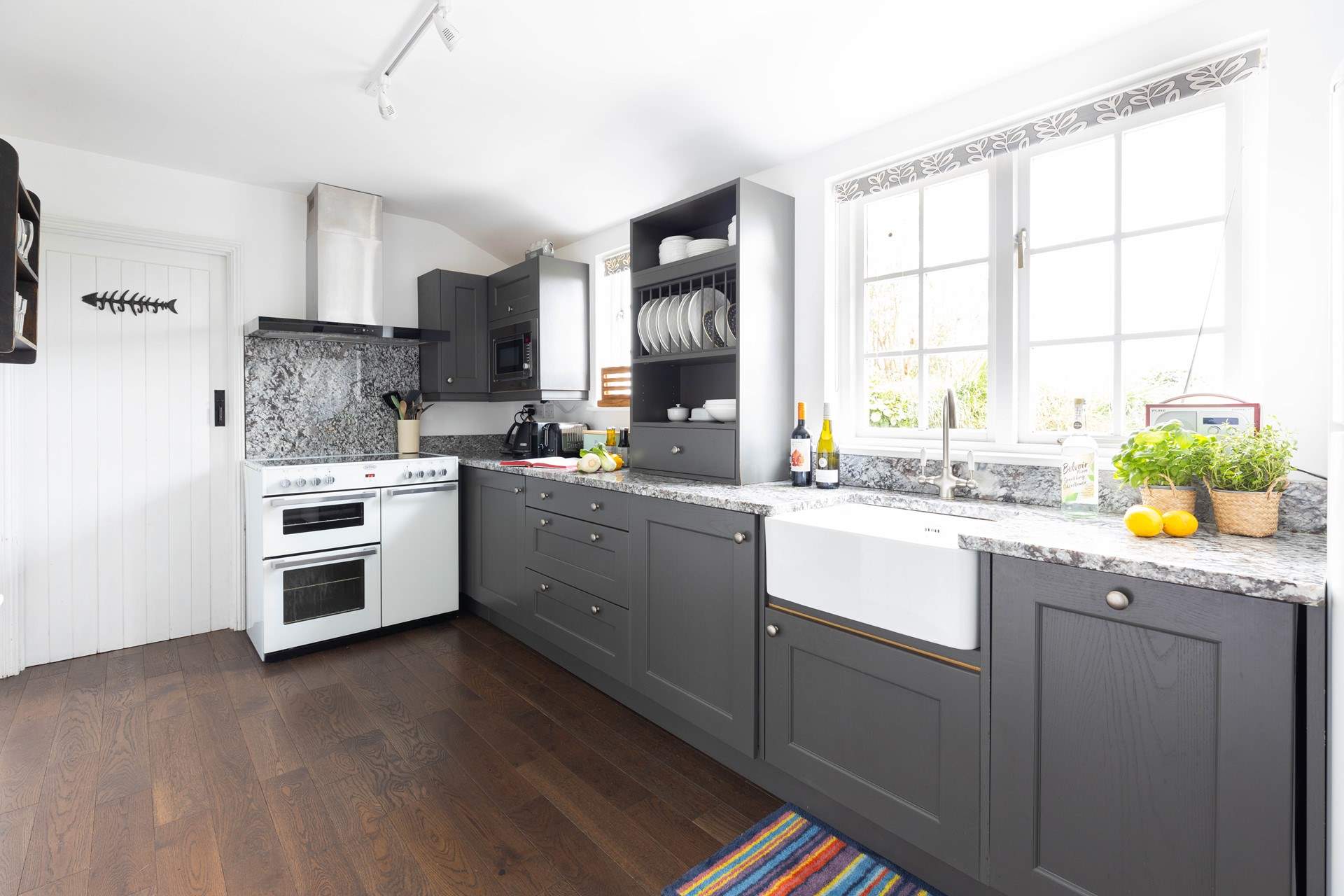 The modern kitchen is spacious and stylish. 