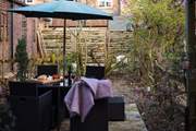 The rustic garden, just waiting for the trees to burst into bloom.