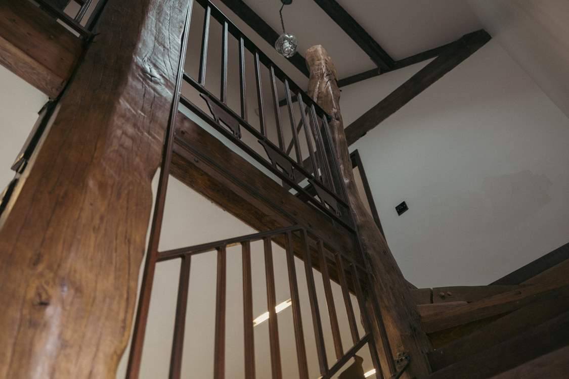 The handmade staircase beams in the sunlight, can you spot Ethel?