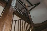 The handmade staircase beams in the sunlight, can you spot Ethel?