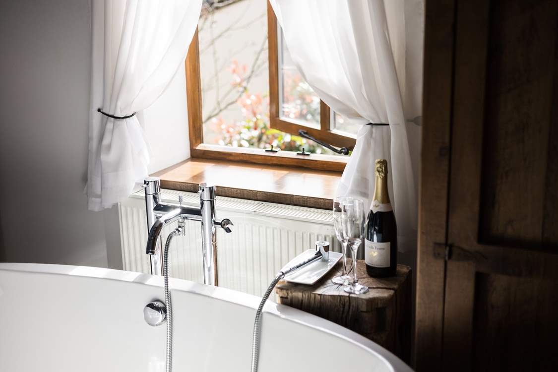 Enjoy a glass of bubbly while soaking in more bubbles!