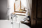 Enjoy a glass of bubbly while soaking in more bubbles!