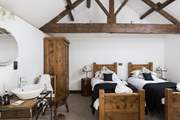 Beautiful twin beds grace this large airy bedroom with fantastic beams. They can also be configured as a king-size double.