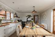 Enjoy the spacious farmhouse kitchen.