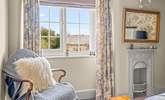 The pretty double bedroom with views across to the church. - Thumbnail Image