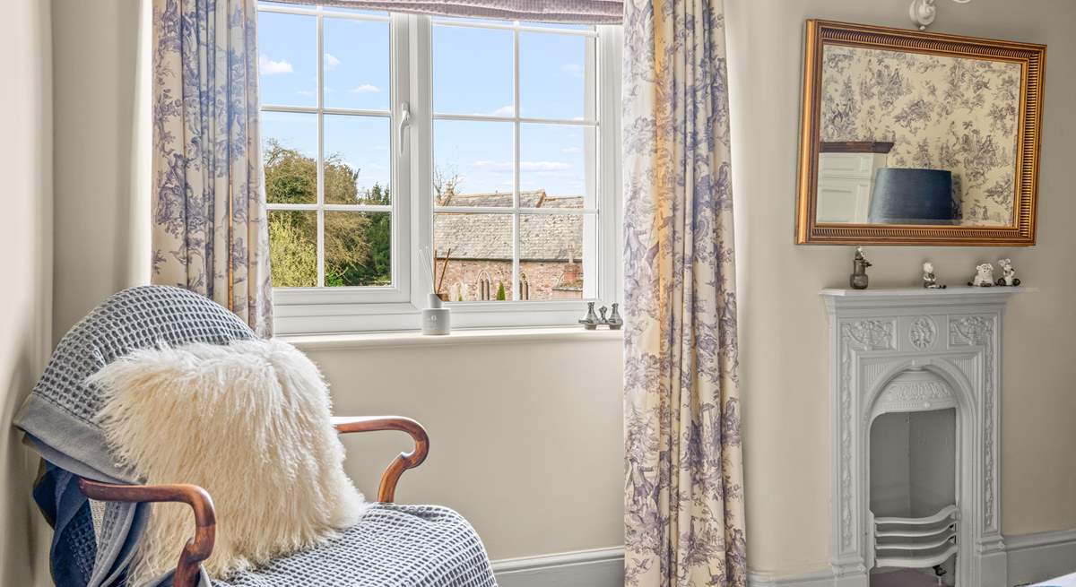 The pretty double bedroom with views across to the church.