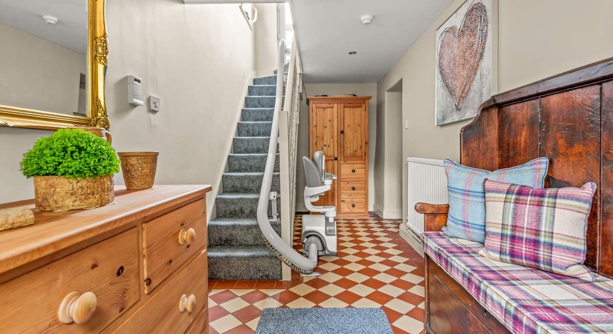 There is even a working stairlift that travels from the entrance hall up to the first floor apartment, Clyst House Apartment.