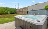 Spend time in the bubbling hot tub. - Thumbnail Image