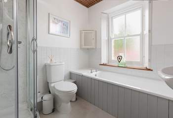 With a separate bath and shower unit, this bathroom will accommodate everyone.