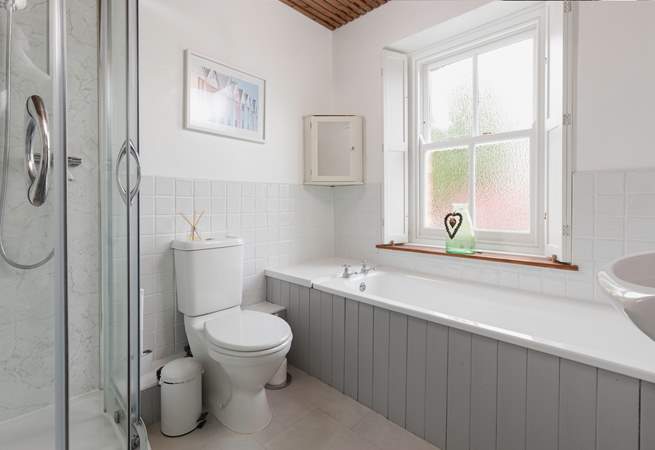 With a separate bath and shower unit, this bathroom will accommodate everyone.