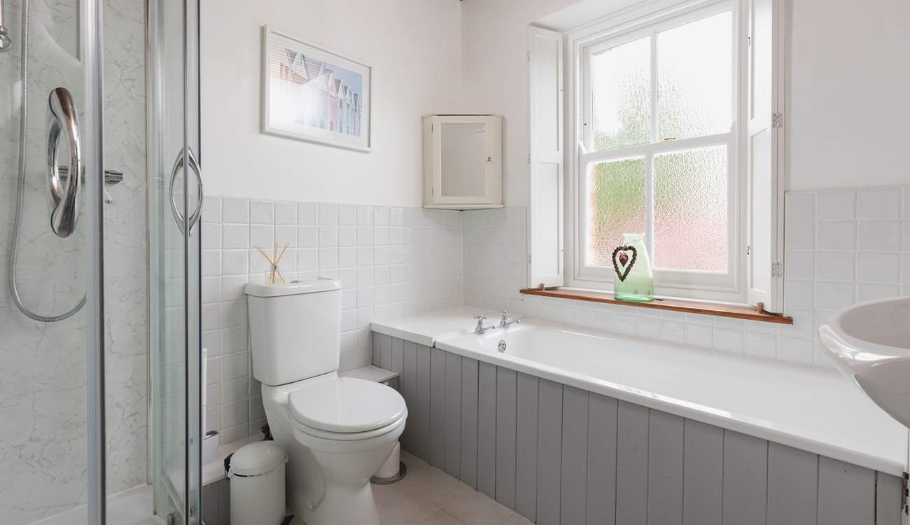 With a separate bath and shower unit, this bathroom will accommodate everyone.