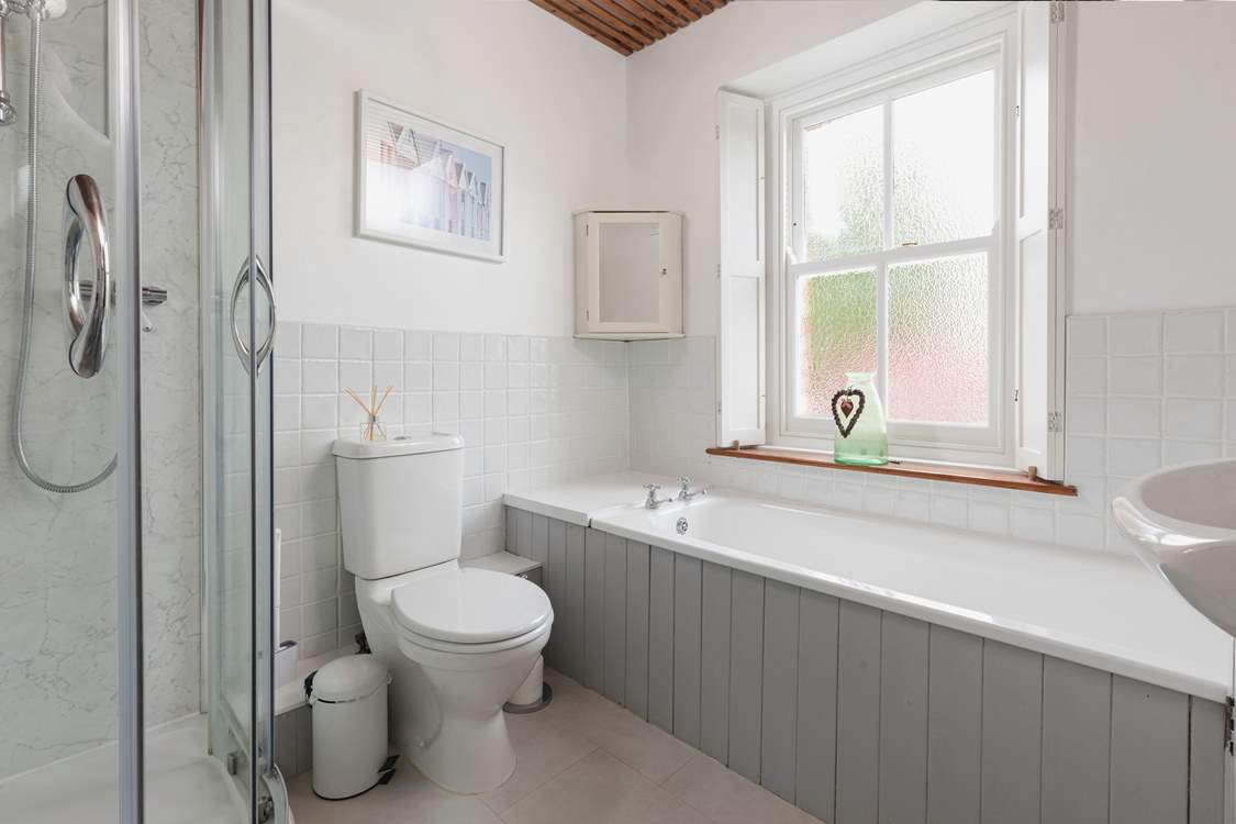 With a separate bath and shower unit, this bathroom will accommodate everyone.