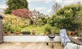 Fire up the barbecue and enjoy evenings in this picturesque garden. - Thumbnail Image