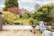 Fire up the barbecue and enjoy evenings in this picturesque garden.