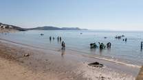 Lyme Regis beach is the perfect spot to dip sandy toes in the sea.