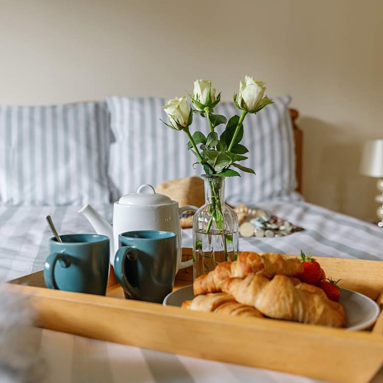 Treat your loved one to breakfast in bed.
