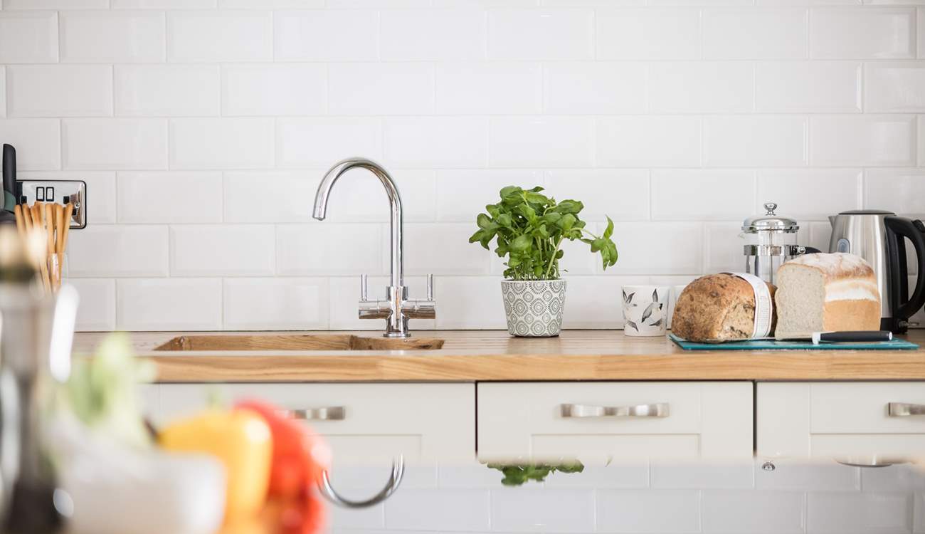 The chef will enjoy spending time in the pretty kitchen.