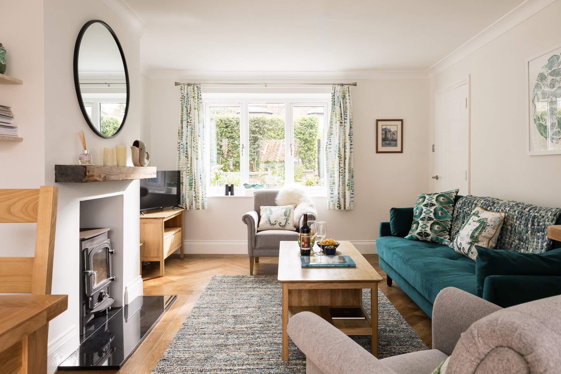 The light and airy sitting-area looks over the flower borders.