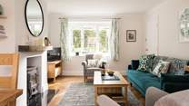 The light and airy sitting-area looks over the flower borders.