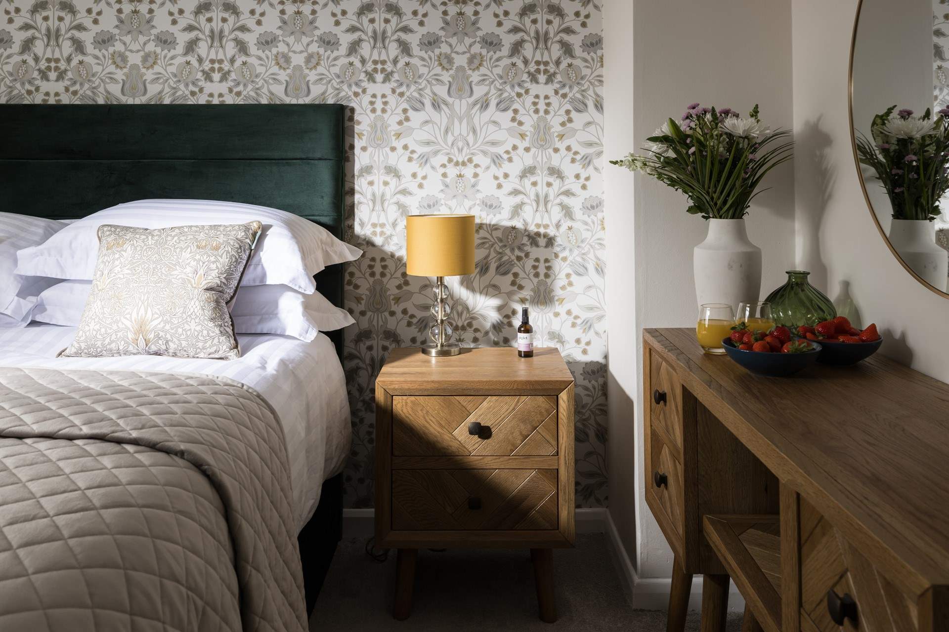 Dappled sunlight highlights the stylish design of this bedroom.