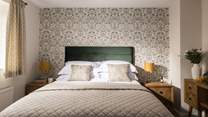 A perfect bedroom to relax in after a day at the sea.
