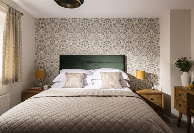 A perfect bedroom to relax in after a day at the sea.