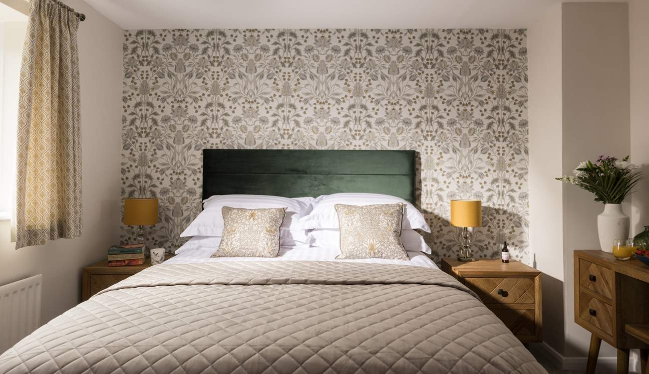 A perfect bedroom to relax in after a day at the sea.