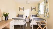 What a jolly twin bedroom.