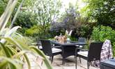 Enjoy an evening in the lush green garden. - Thumbnail Image