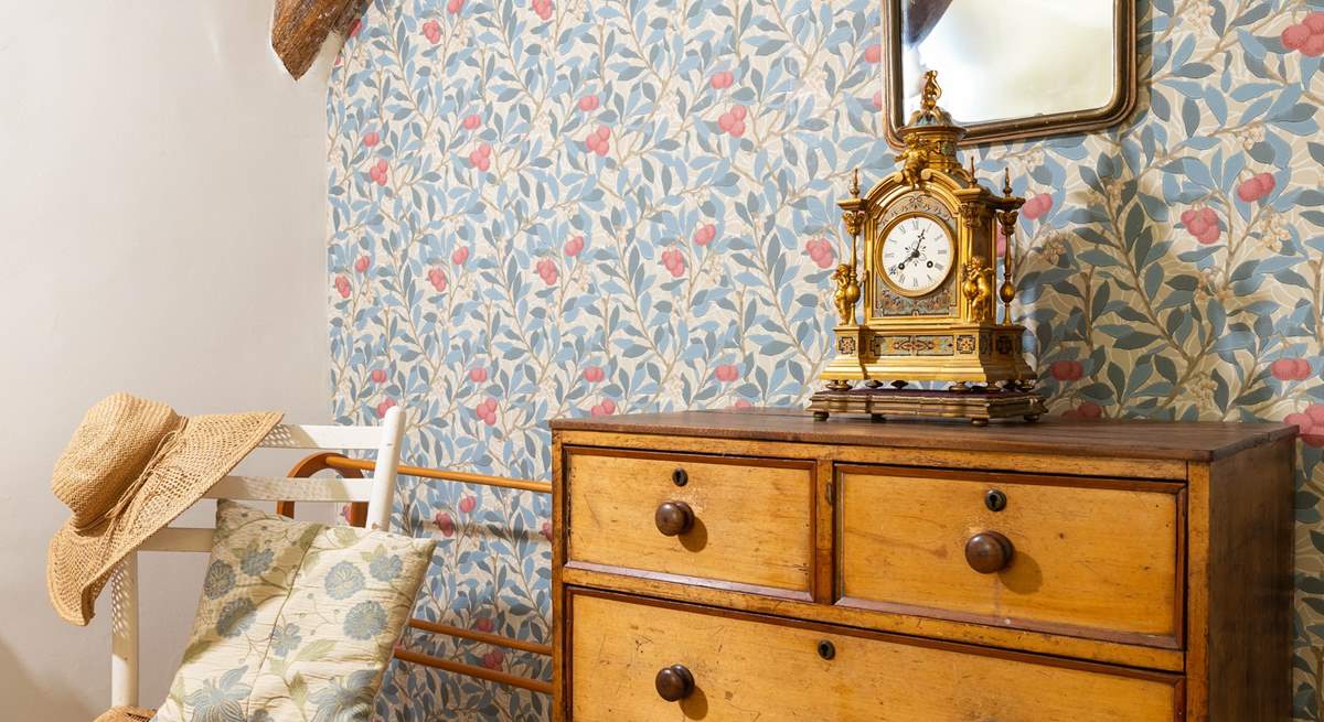 This bedroom has been styled to complement the age of this gorgeous cottage.