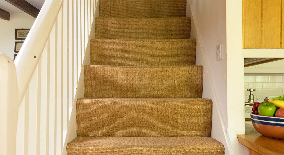 Head up the stairs to discover all three bedrooms, please note that those taller members of the family might need to duck when climbing and descending the stairs. 