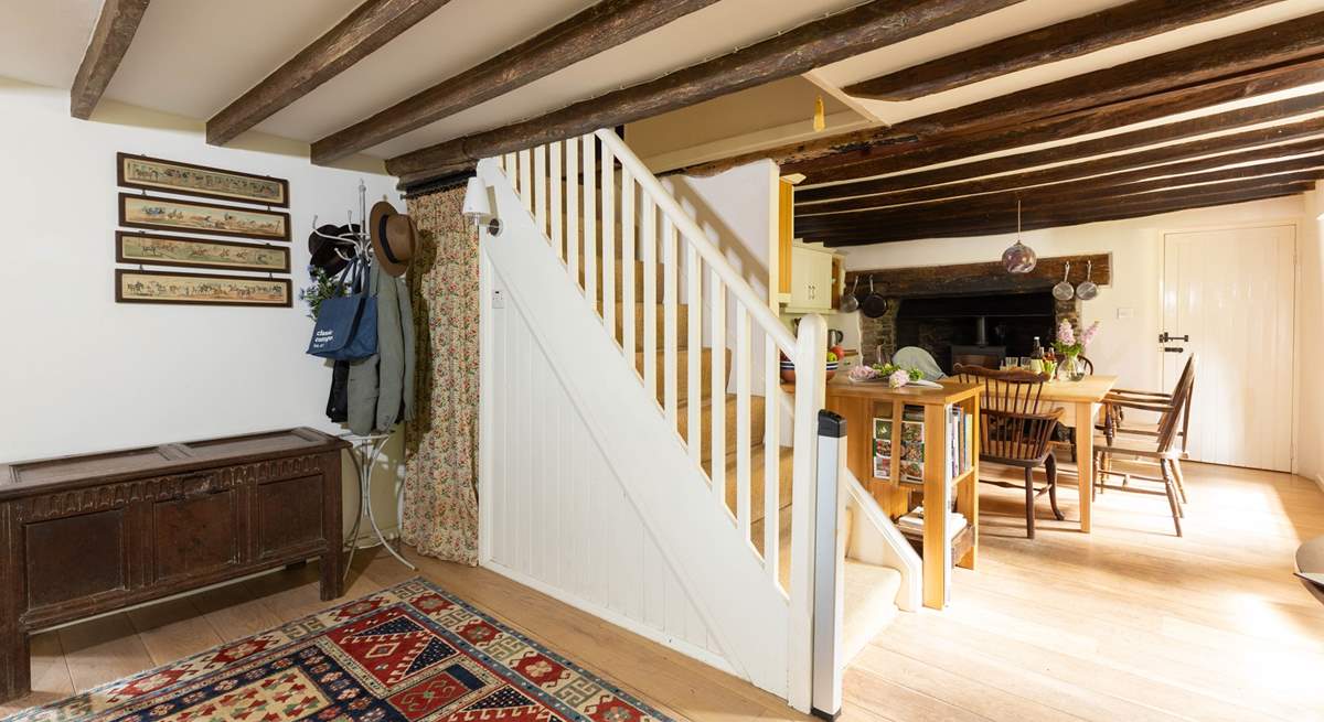 The door to the right of the wood-burner leads to the utility-room.