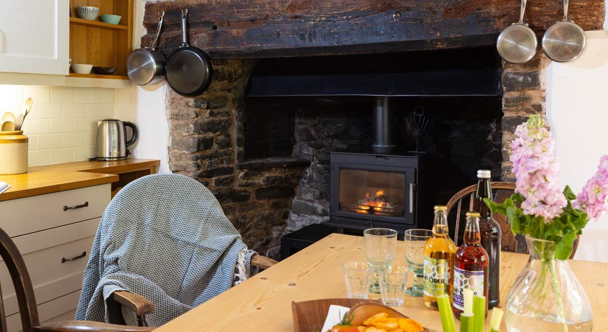 The kitchen/diner boasts a toasty wood-burner.