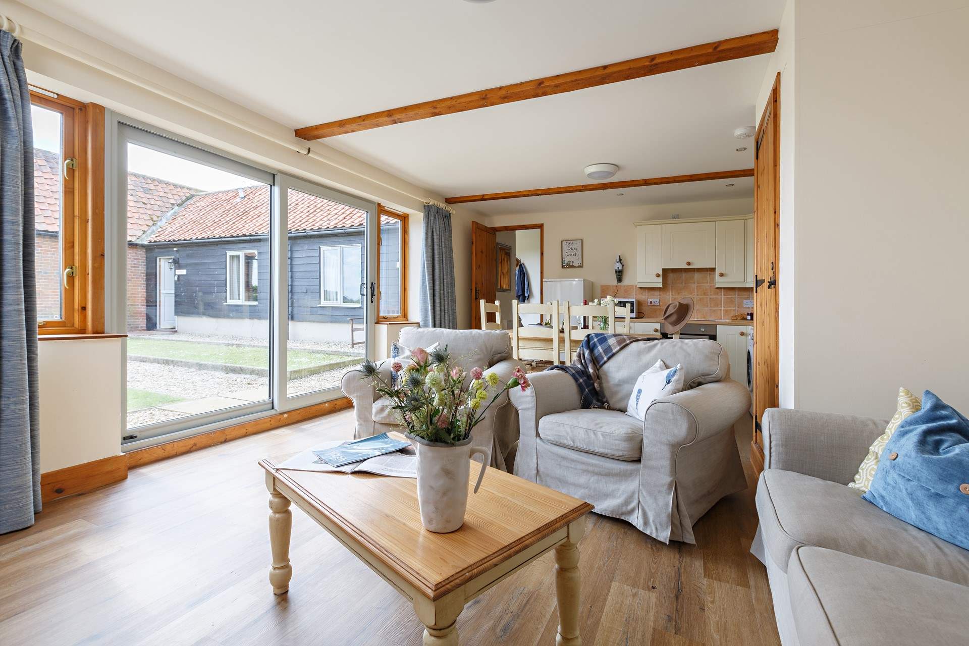 The open plan living space overlooks the sheltered shared courtyard garden.