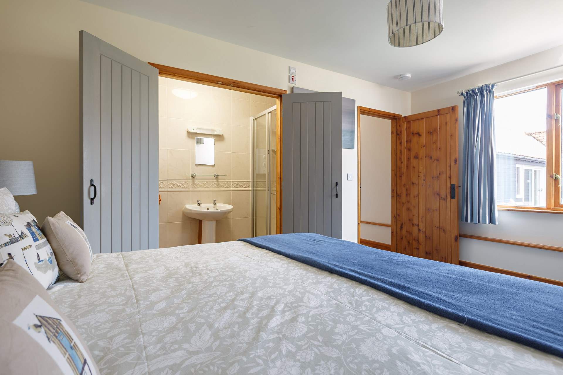 Open up the doors to find your private en suite shower-room.