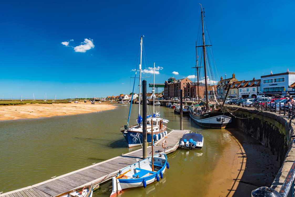 The big blue skies over the bustling harbour in Wells-next-the-Sea