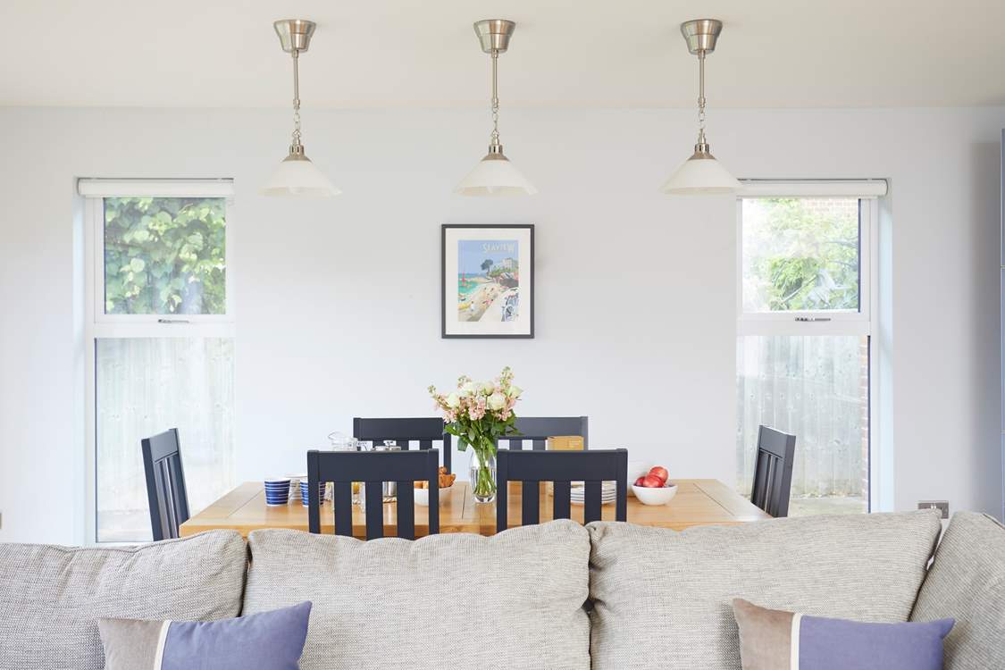 The open plan living space has enough space to sit and dine in.