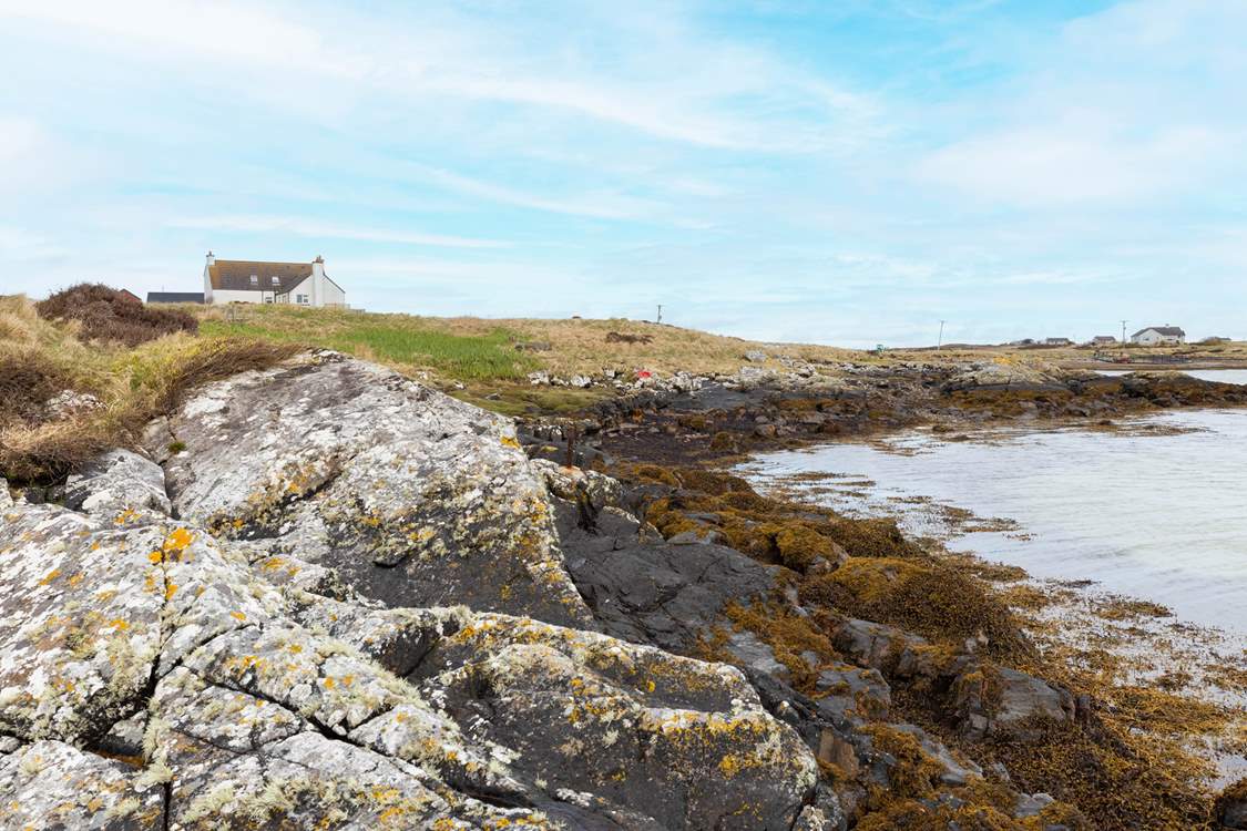 The shoreline is only metres away from your front door.