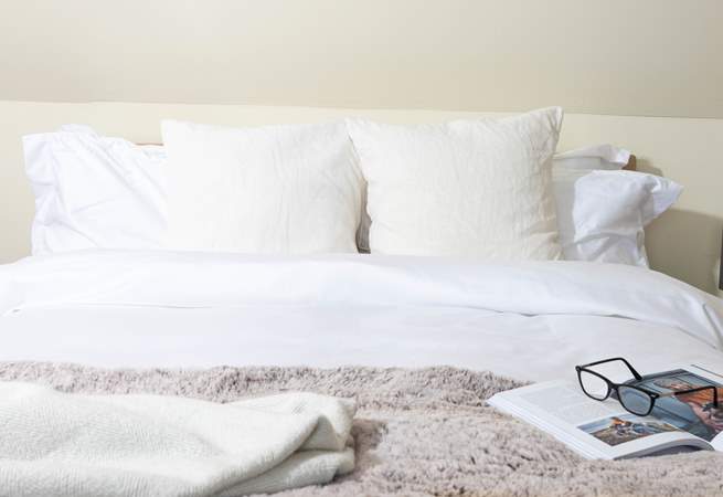 Snuggle into the fluffy pillows. 