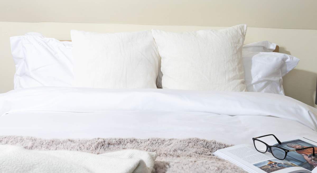 Snuggle into the fluffy pillows. 