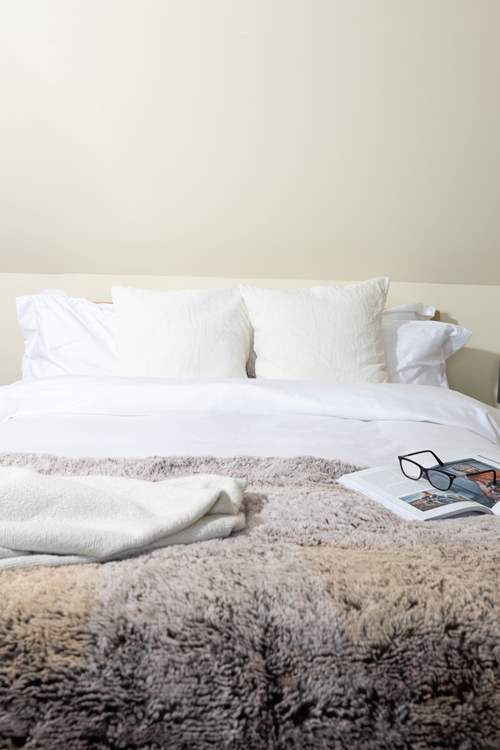 Snuggle into the fluffy pillows.