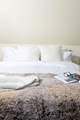 Snuggle into the fluffy pillows.