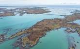 The seas around Benbecula are crystal clear, azure blue and sparkling.  - Thumbnail Image