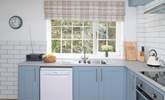 Light floods the sunny kitchen.  - Thumbnail Image