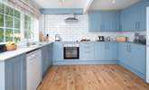 Tranquil blues in the well-equipped, stylish kitchen.  - Thumbnail Image