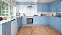 Tranquil blues in the well-equipped, stylish kitchen. 